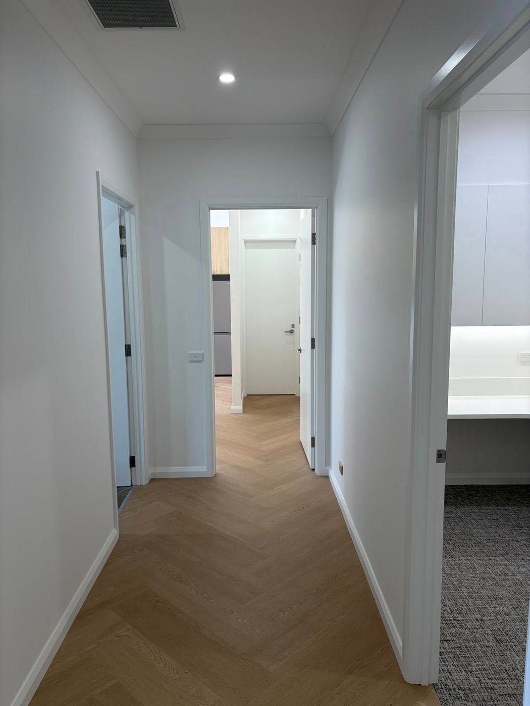 Corridor with herringbone flooring