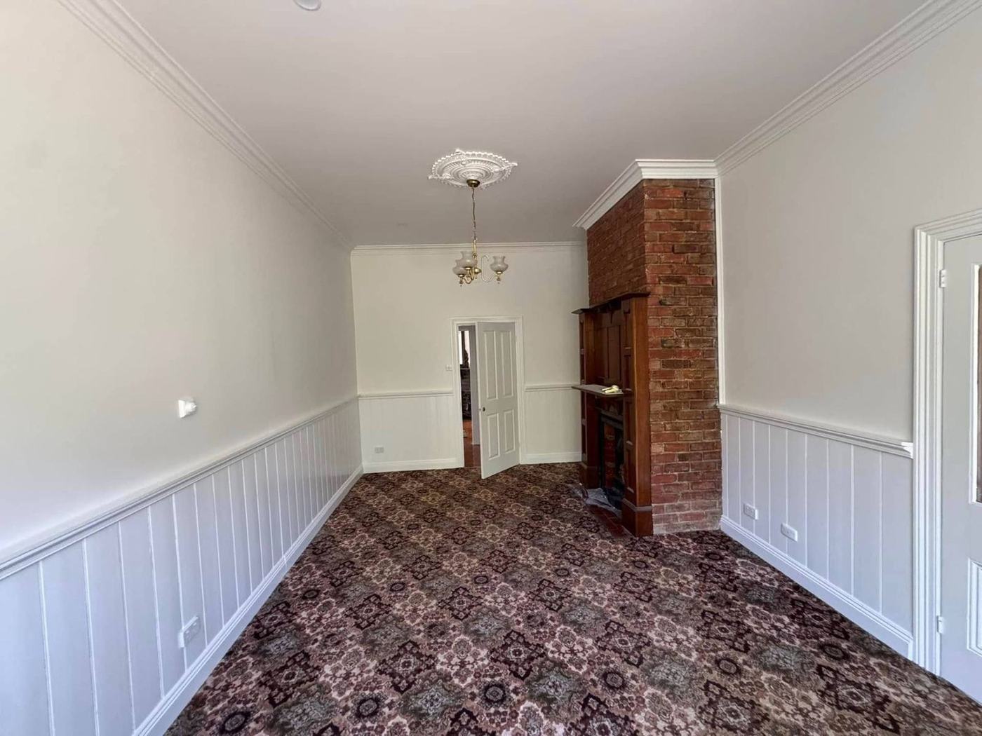 Dining room with brick fireplace
