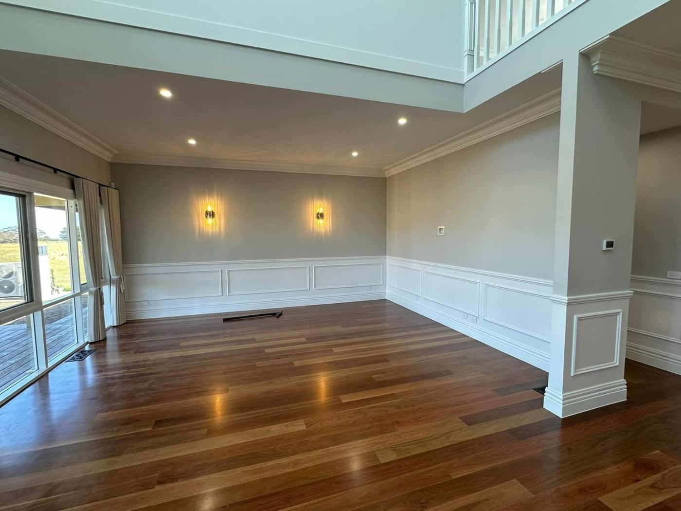 Living area with wall sconces